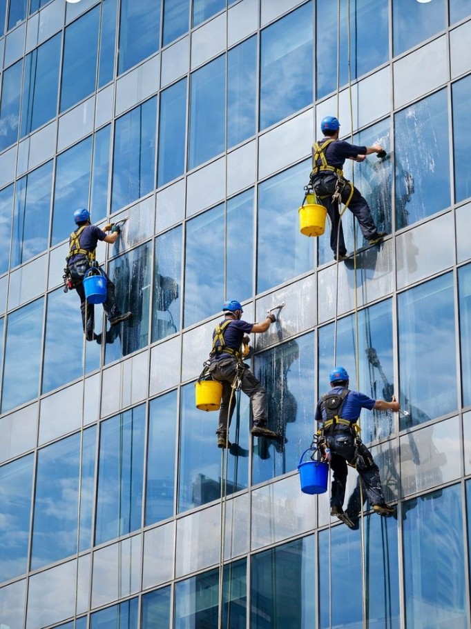 CleanEx rope-access team cleaning a high-rise façade